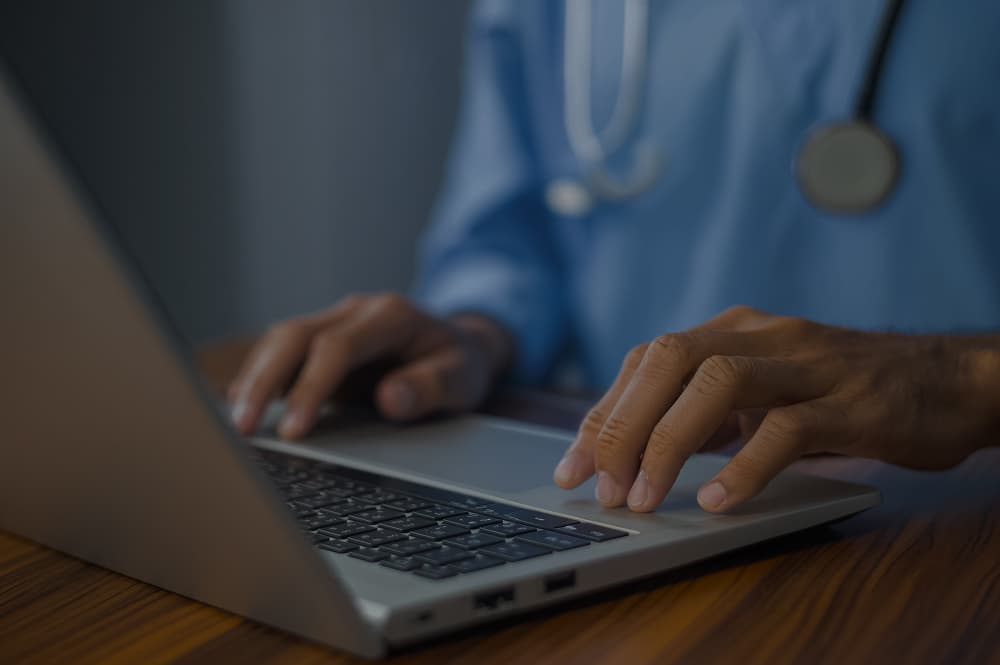 An Evida GP reviewing a patient record